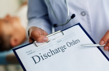 discharge orders on clipboard