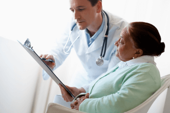 doctors and elderly female patient